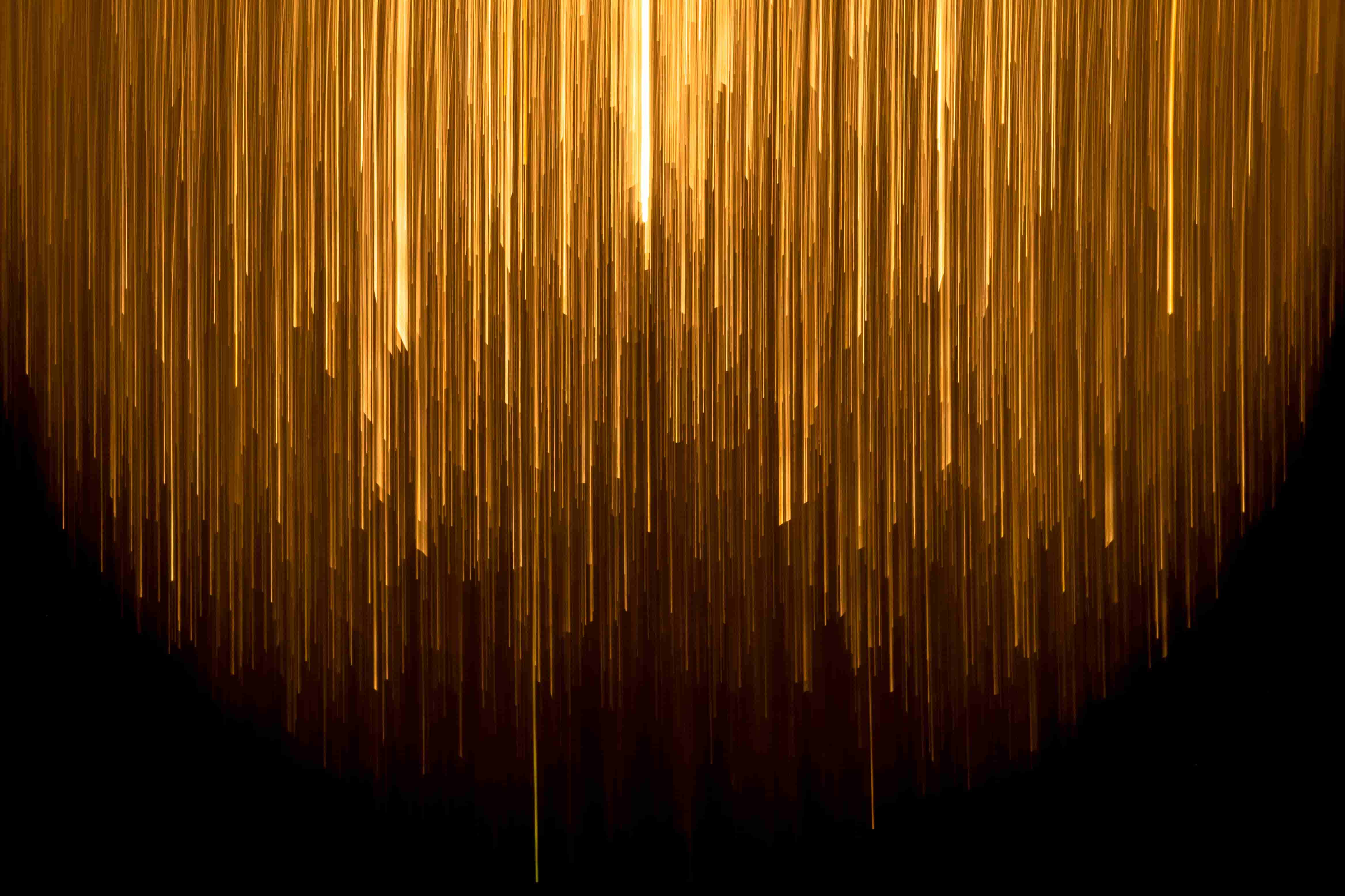 decorative image. thin gold columns hanging down